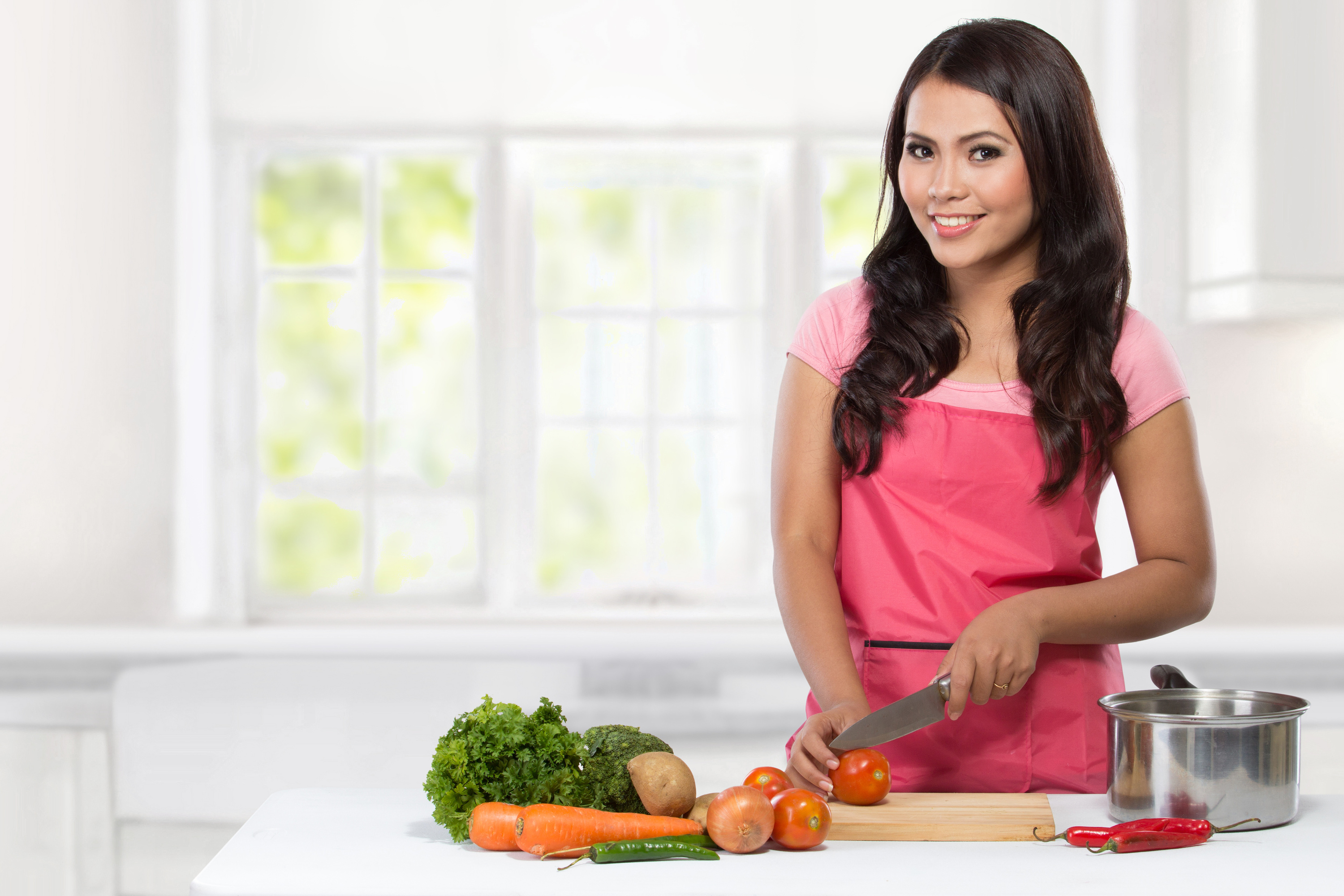 Young Woman Cooking in the Kitchen